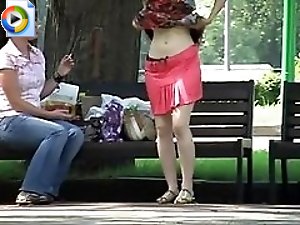 2 movies - Real voyeur upskirt of a hot girl trying on her new skirt right in the park