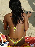 Upskirt pictures - A busty bikini lady undressing on the Natadola