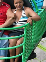12 pictures - Babe flashed on a ride. Accidental upskirt, in public