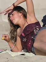 24 pictures - Beach upskirt. Very sexy chick in denim mini skirt peeked