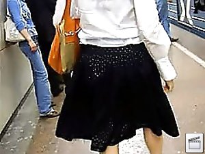 4 movies - Nice lady in black skirt doesn't notice the guy shooting her panties