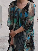 12 pictures - Wind upskirt - Wind lifts her dress's skirt up