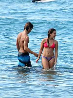 12 pictures - Girls in bikinis lying and bent over