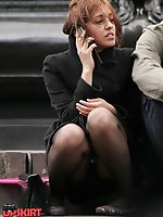 12 pictures - Sitting upskirt. Redhead spyed sitting on stairs